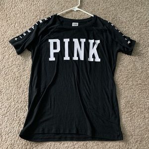 black PINK tee shirt with pink writing on sleeves
